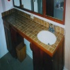 outdated tile counter top and basin